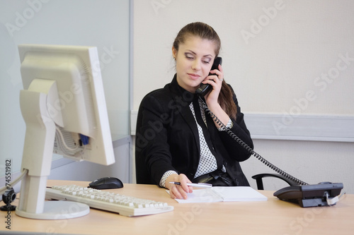 Girl secretary in an office