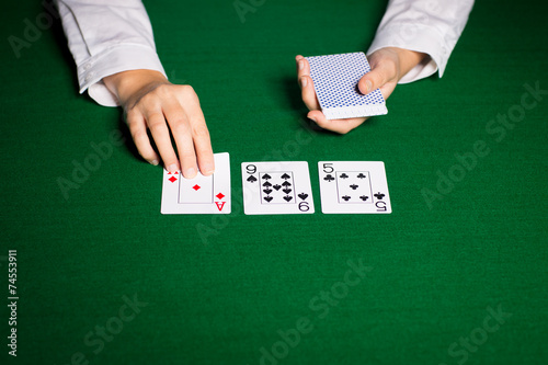 holdem dealer with playing cards