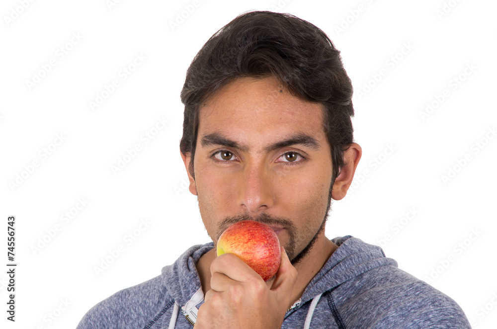 handsome young man biting red apple handsome young man biting red apple