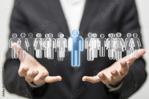 personal Businessman holding 3D rendering group of blue people 