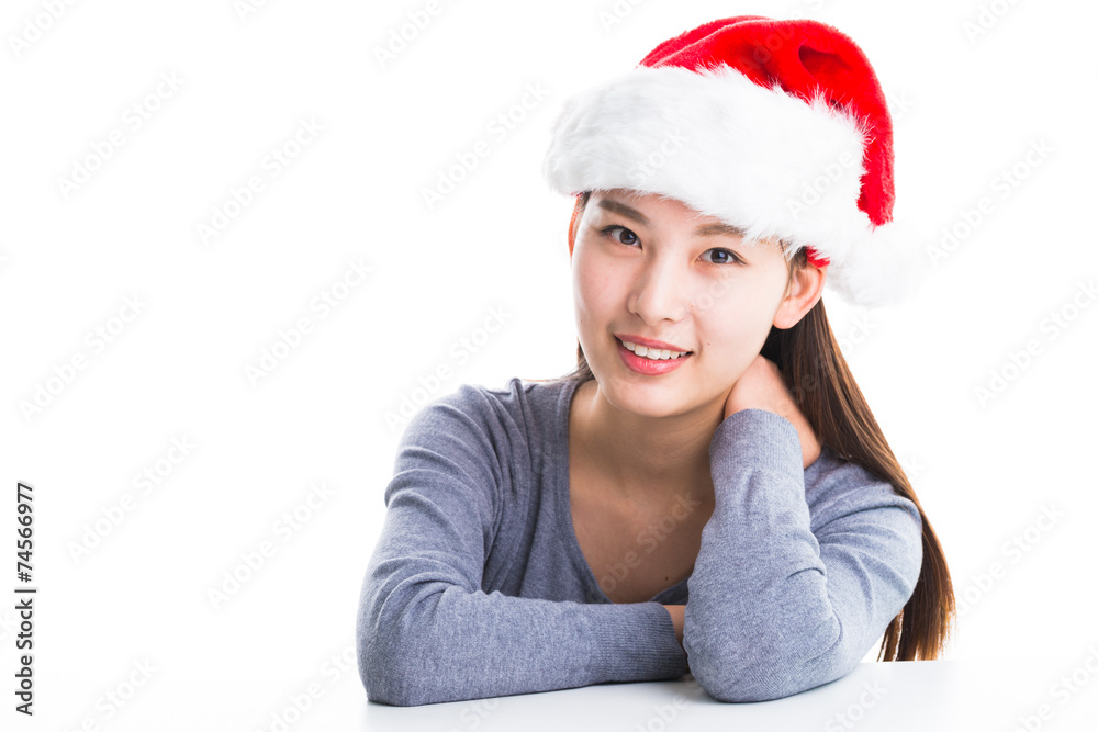 Young asian woman with Christmas hat isolated on white. Young asian woman with Christmas hat isolated on white.