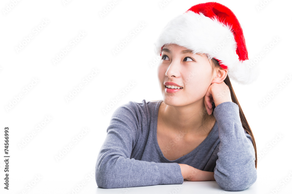 Young asian woman with Christmas hat isolated on white. Young asian woman with Christmas hat isolated on white.