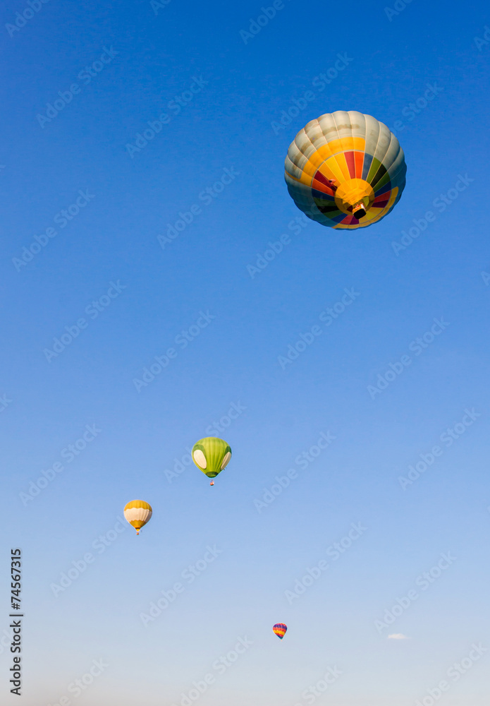Fototapeta premium Hot air balloon on blue sky background