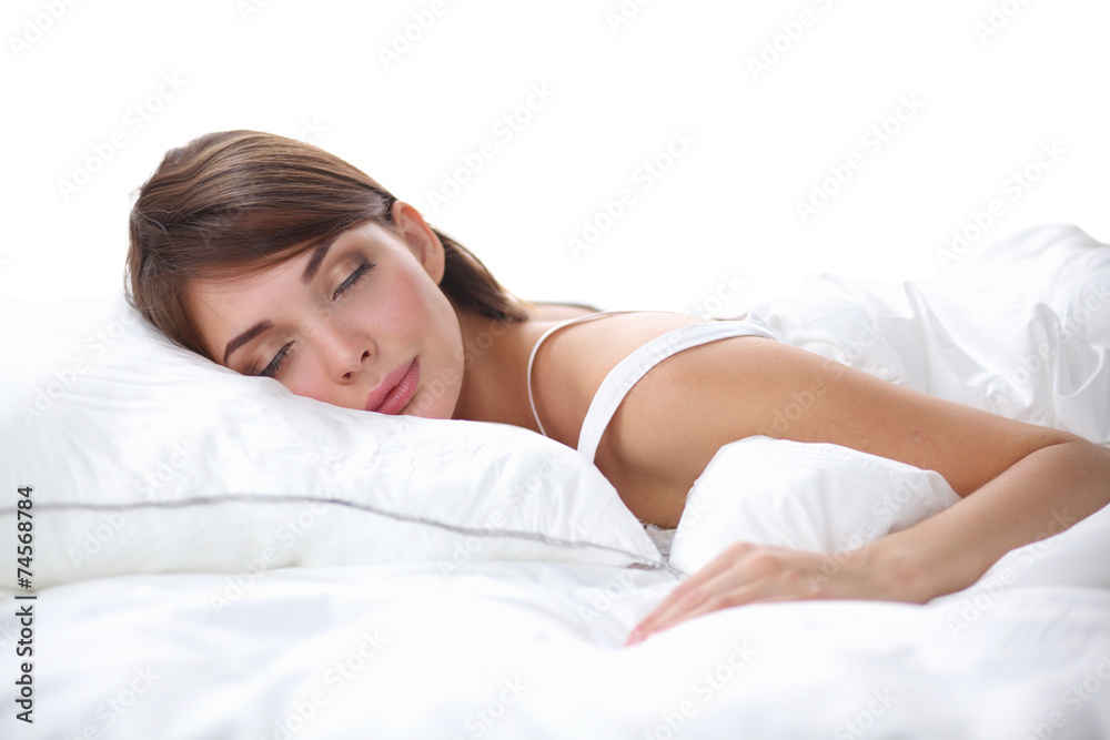 Beautiful girl sleeps in the bedroom, lying on bed Beautiful girl sleeps in the bedroom, lying on bed