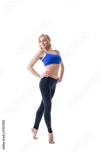 Smiling blonde sportswoman, isolated on white