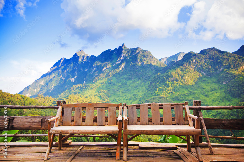 Bamboo wood chair with the background of mountain in Thailand