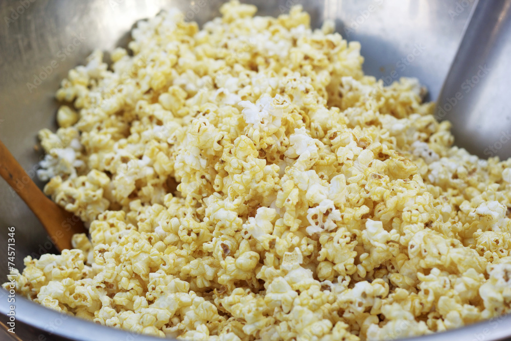 popcorn a caramel coated in a bowl. popcorn a caramel coated in a bowl.