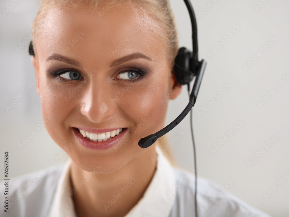 Close-up portrait of a customer service agent sitting at office Close-up portrait of a customer service agent sitting at office