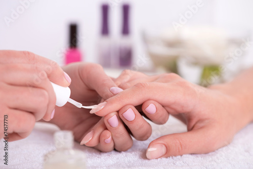 client and manicurist in manicure salon photo