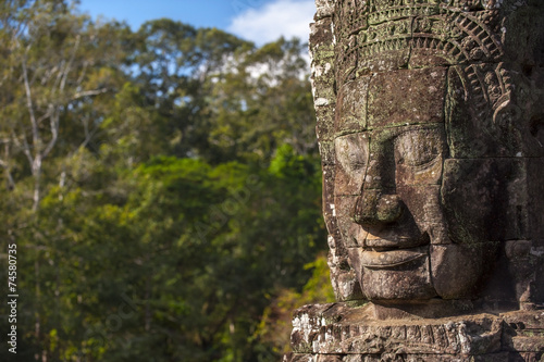 Ancient stone face of Bayon temple © shirophoto