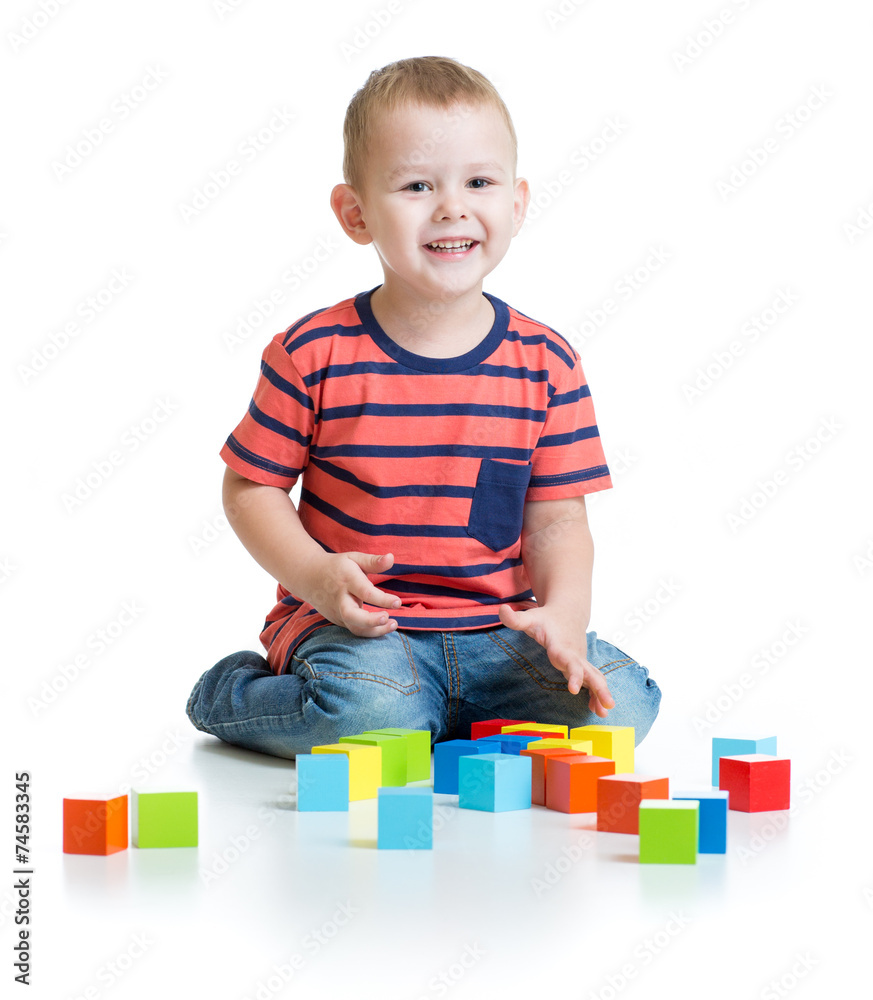 Kid playing and building tower with colorful blocks isolated Kid playing and building tower with colorful blocks isolated
