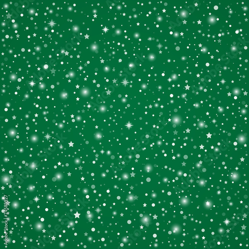 Green Christmas background with sparkling stars and flakes