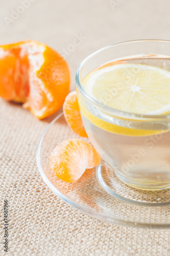 Orange mandarin or tangerine fruit and lemon tea