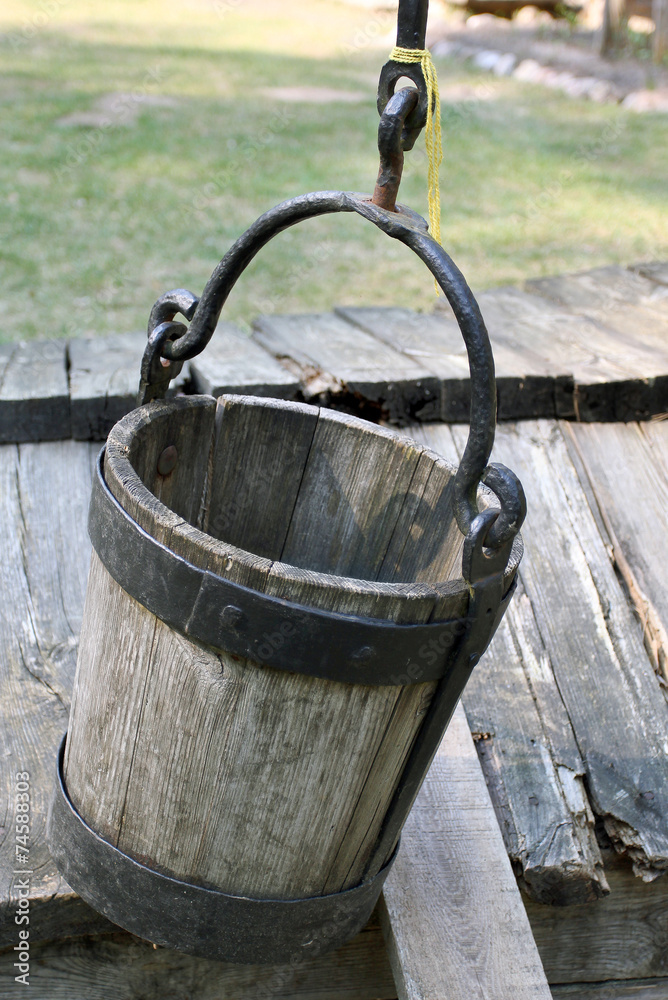 The old wooden bucket in the historical village The old wooden bucket in the historical village
