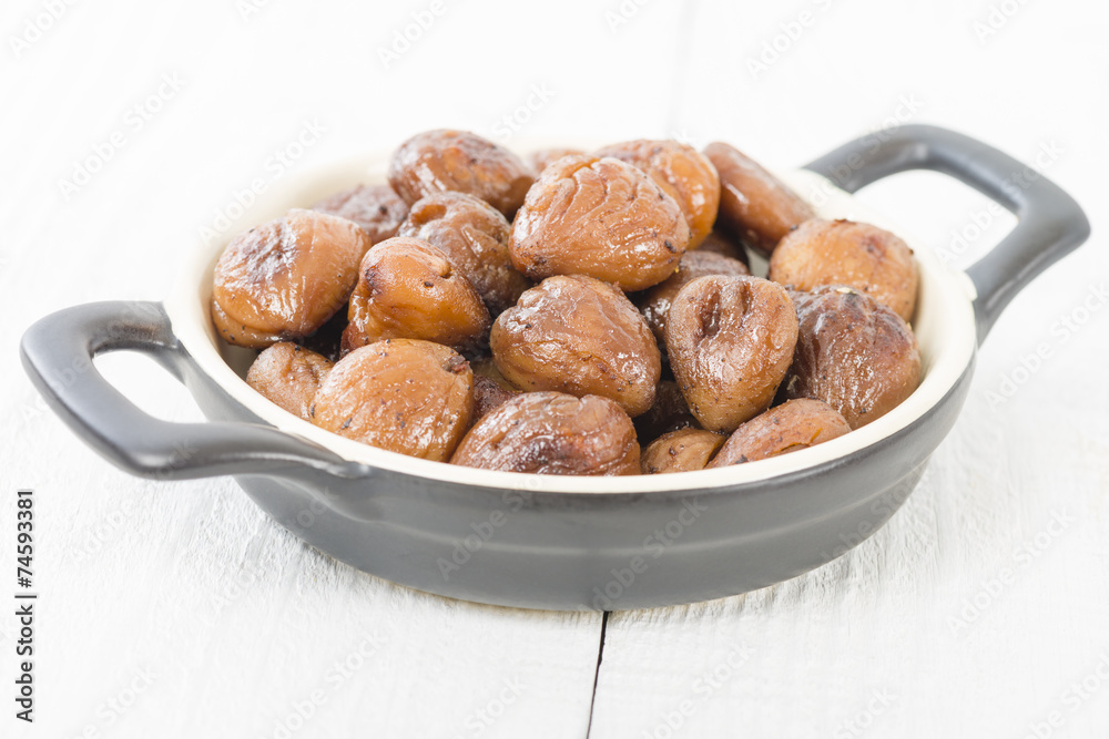 Chestnuts - Peeled and cooked chestnuts on a white background. Chestnuts - Peeled and cooked chestnuts on a white background.