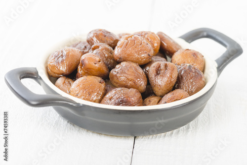 Chestnuts - Peeled and cooked chestnuts on a white background.