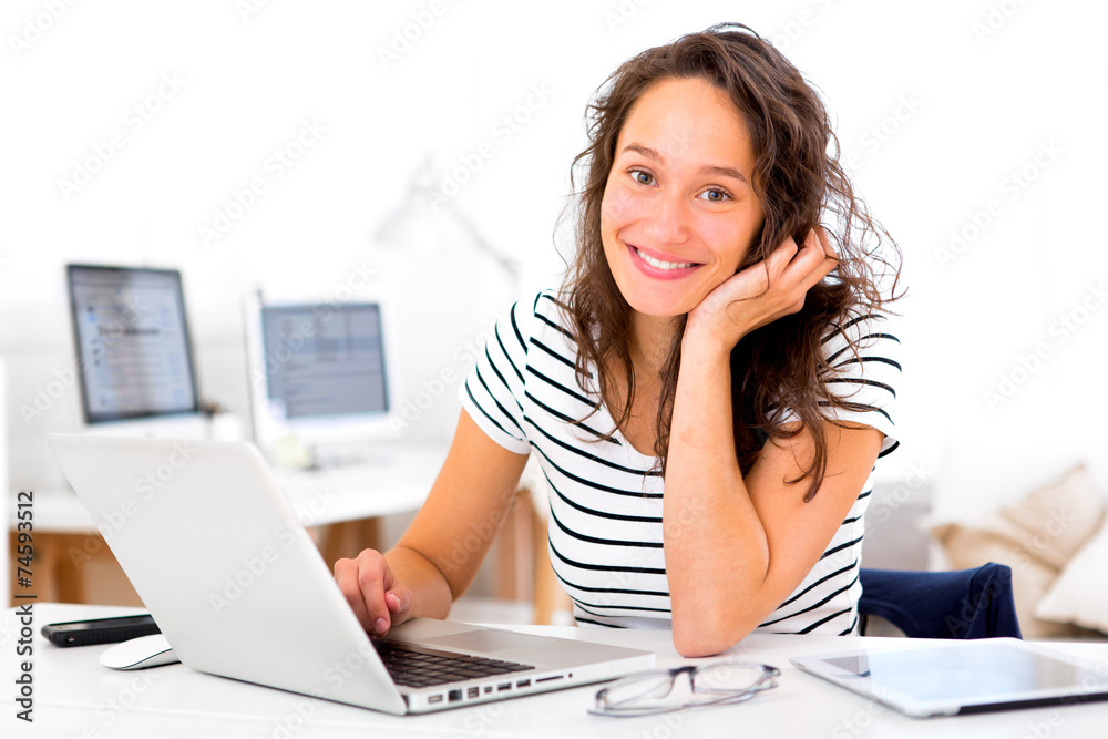 Young attractive student woman working at home Young attractive student woman working at home