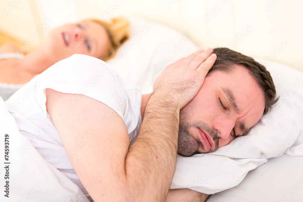 Young man can't sleep because of girlfriend's snoring Young man can't sleep because of girlfriend's snoring