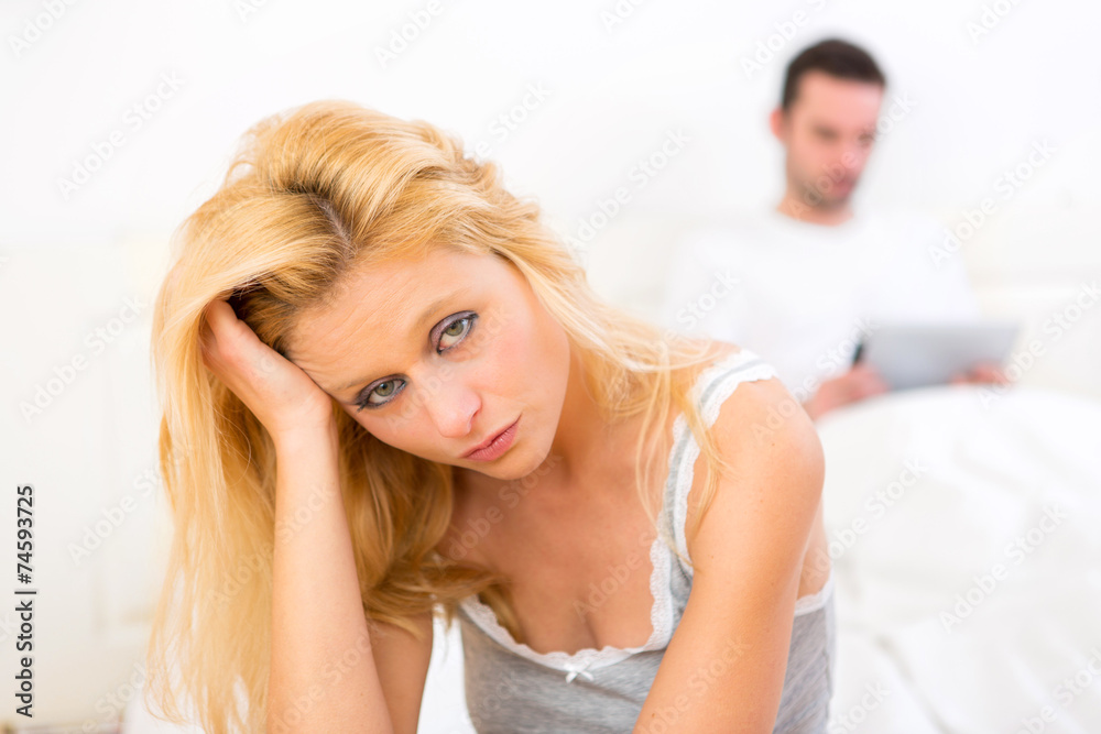 Fototapeta premium Young attractive couple having an argue in bed