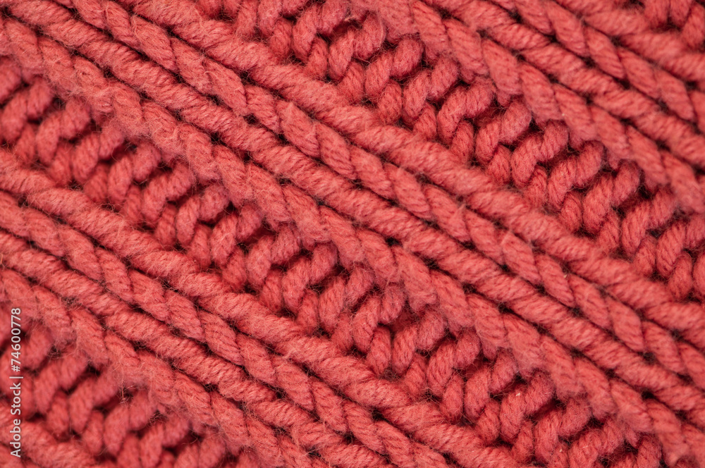 Pink knitting background diagonal close up Pink knitting background diagonal close up