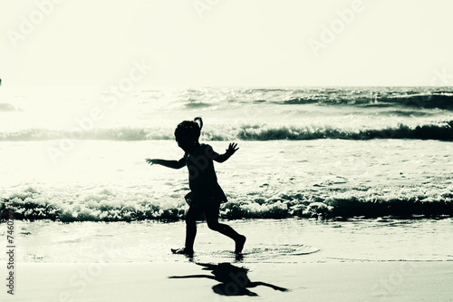 girl playing on the beach