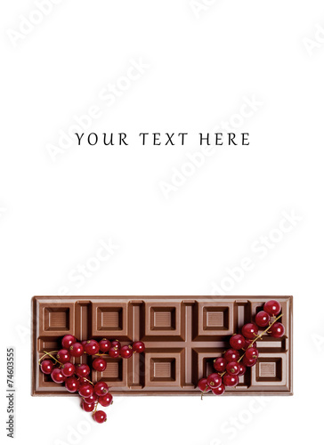 Chocolate bar with red currant blank space above photo