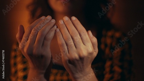 Muslim woman praying to god.