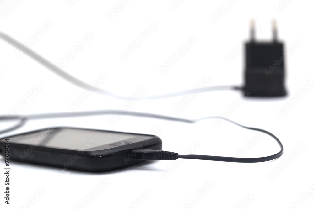 phone with an adapter on a white background phone with an adapter on a white background