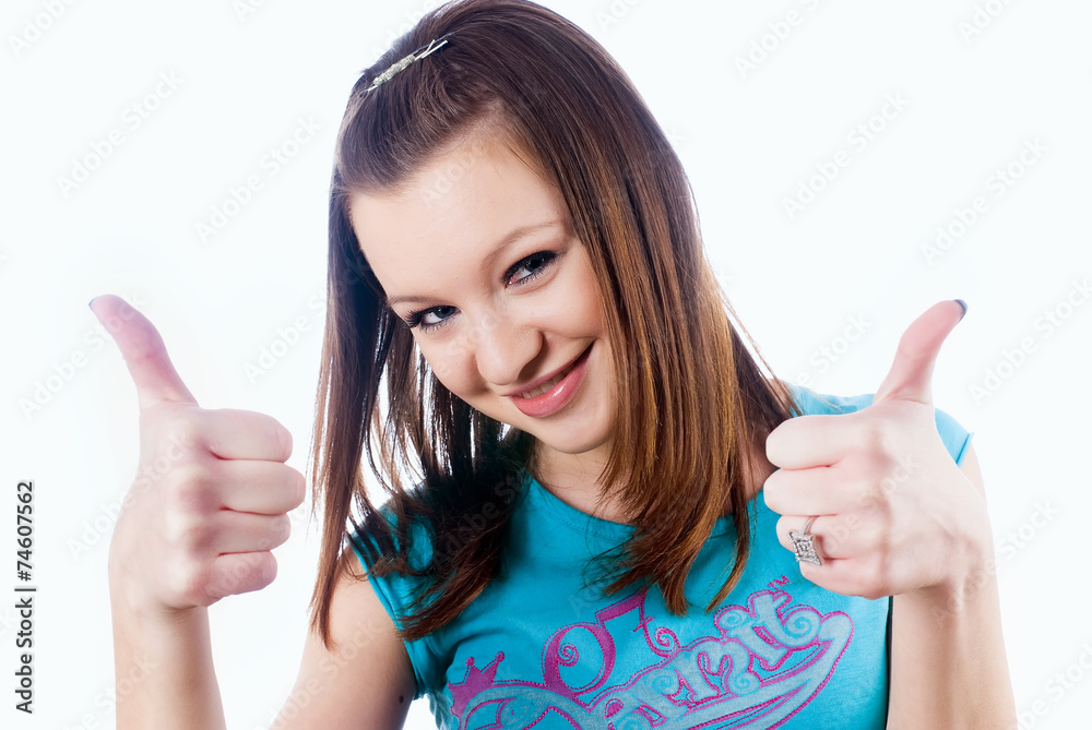 Attractive girl showing thumb up gesture Attractive girl showing thumb up gesture