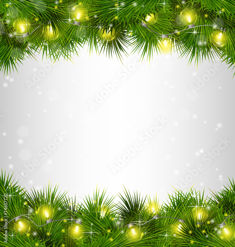 Yellow Christmas lights on pine branches on grayscale background