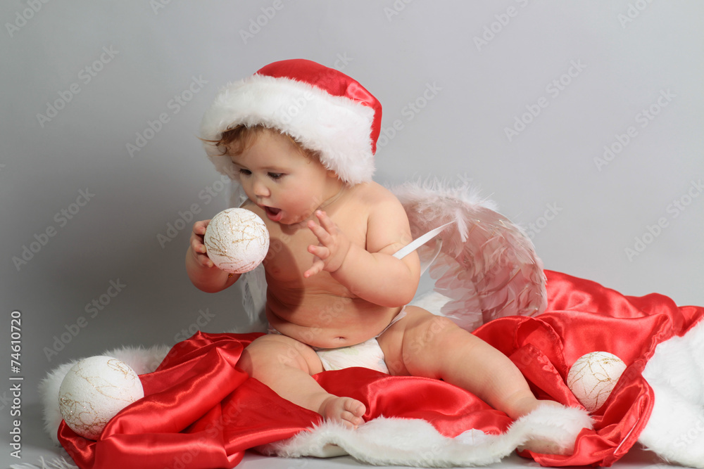 little boy with Santa and angel costume