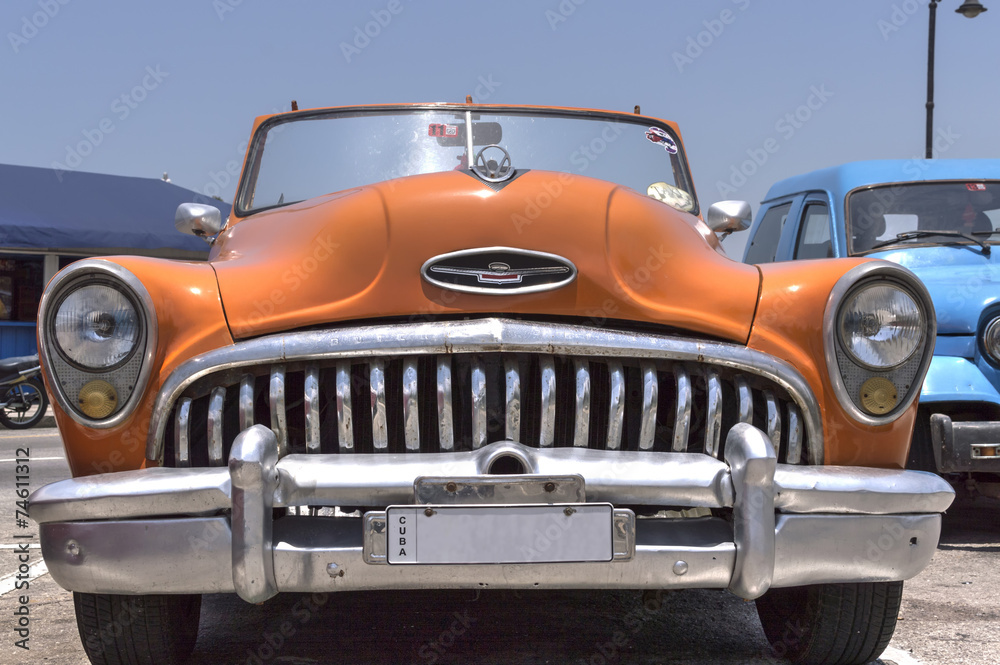Classic orange american car in Havana, Cuba