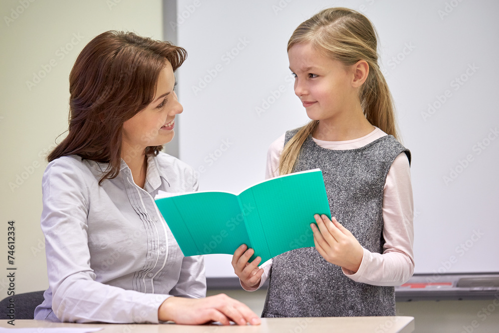 school girl with notebook and teacher in classroom school girl with notebook and teacher in classroom