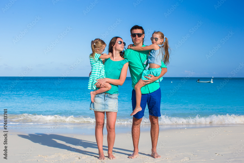 Young happy family with two kids on summer vacation Young happy family with two kids on summer vacation