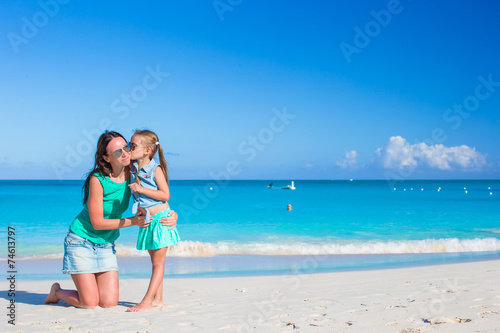 Young mom and little girl during summer vacation