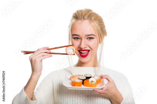 White-haired girl eating sushi with a chopsticks, isolated