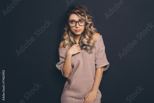 Portrait of a young beautiful blond-haired wearing trendy glasse © arthurhidden
