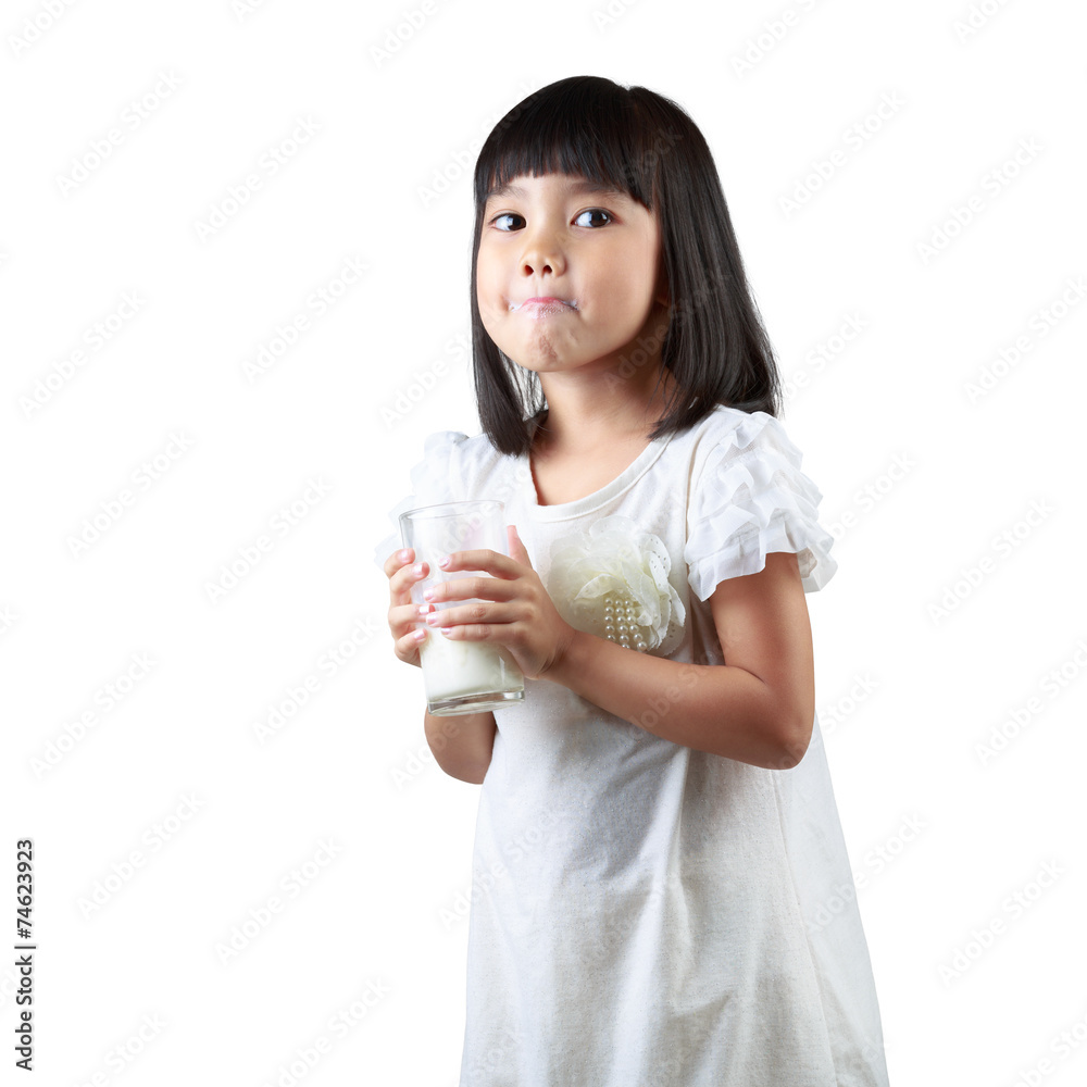 Happy little Asian girl holding a cup of milk Happy little Asian girl holding a cup of milk