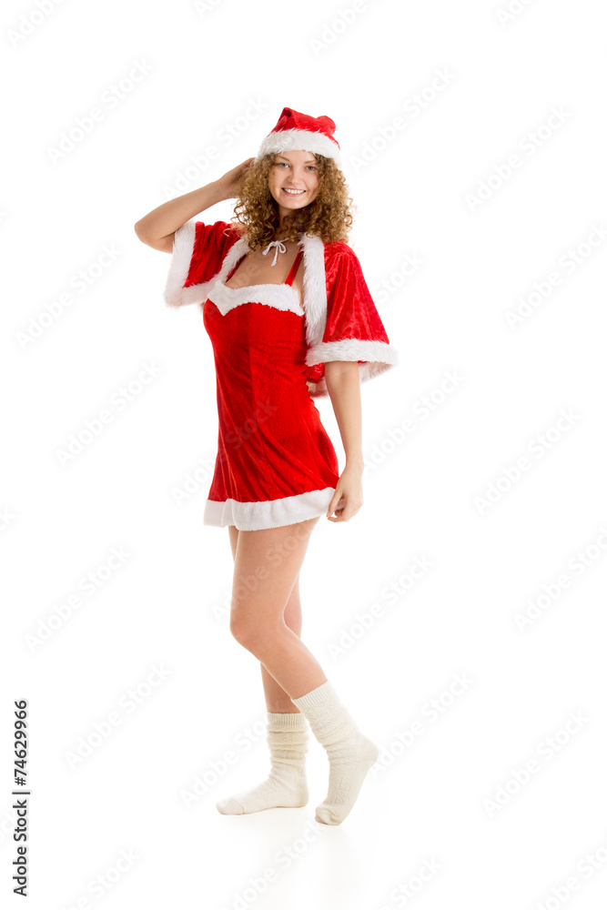 Santa girl poses in Christmas dress full length Santa girl poses in Christmas dress full length