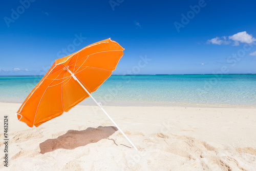 Photography orange sunshade at the beach
