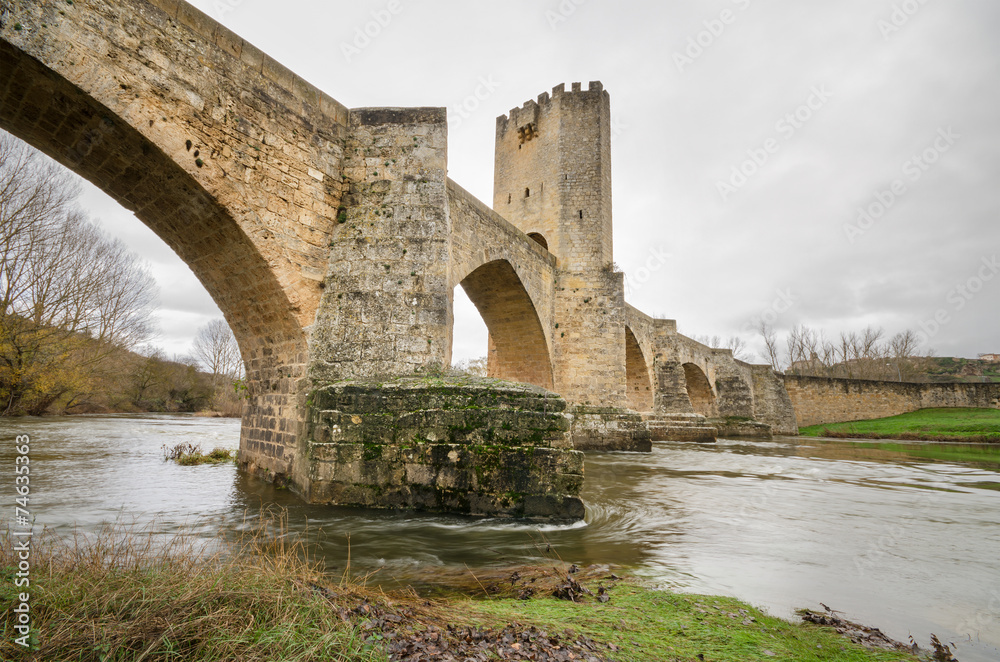 Ancient medieval bridge on a cloudy day in Frias, Burgos, Spain.
