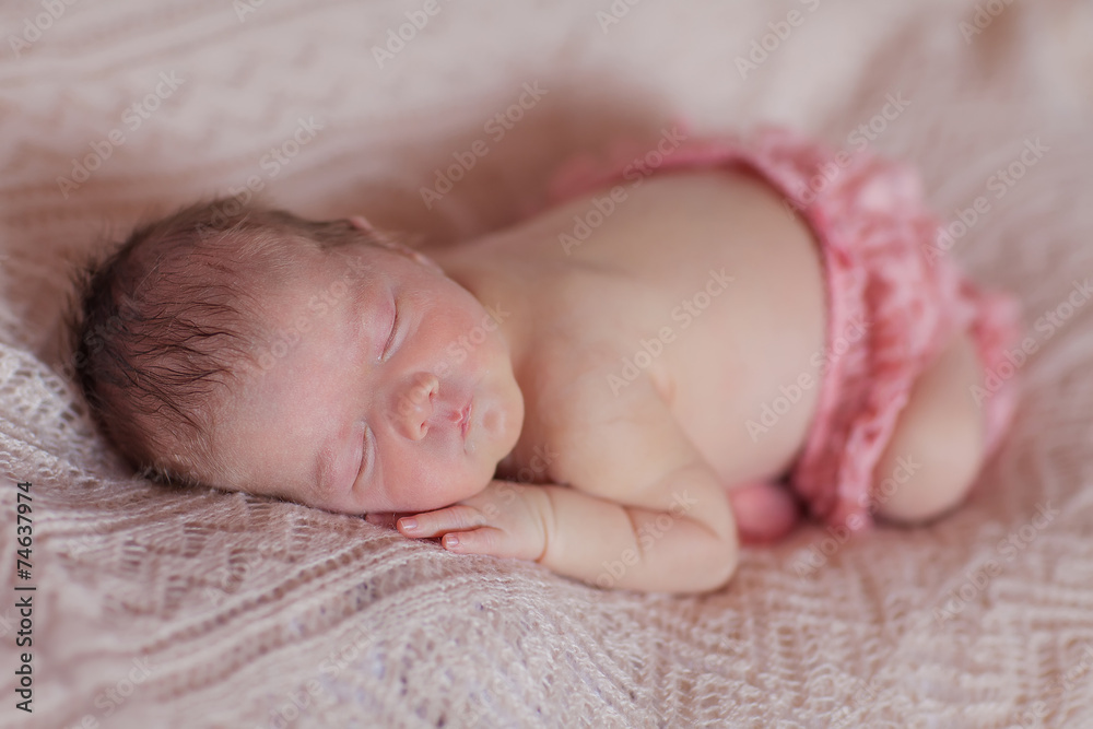 Caucasian newborn baby while sleeping closeup Caucasian newborn baby while sleeping closeup