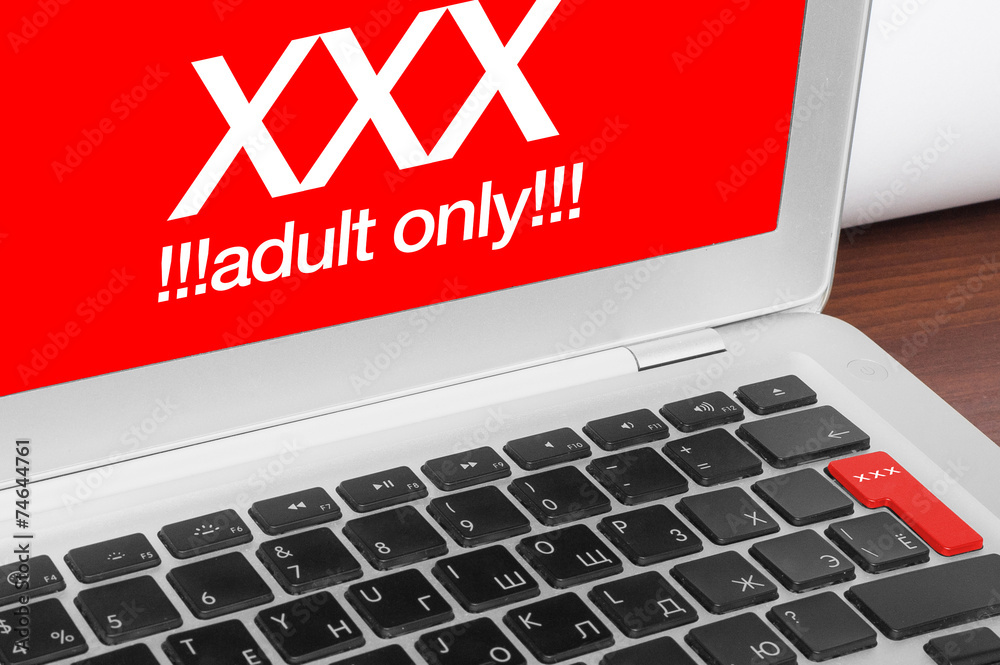 Online porn concept. XXX adults only message on silver laptop an Stock  Photo | Adobe Stock
