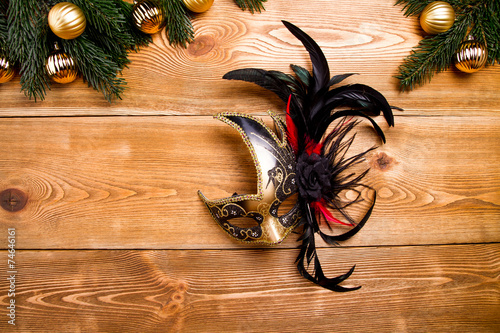 Carnival maskon a wooden table photo