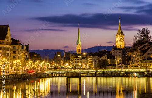 Zurich on banks of Limmat river on a winter evening