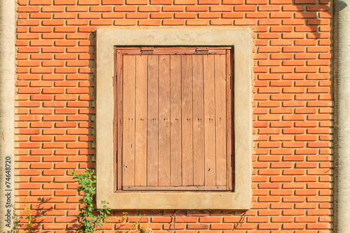 Old wood window and brick wall background