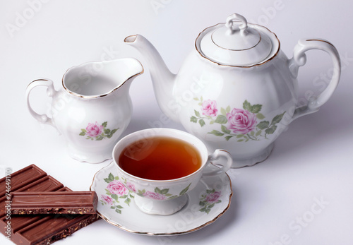 white tea set floral dishware with chocolate