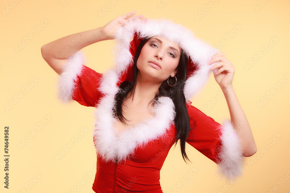 Portrait woman wearing santa claus costume on yellow Portrait woman wearing santa claus costume on yellow
