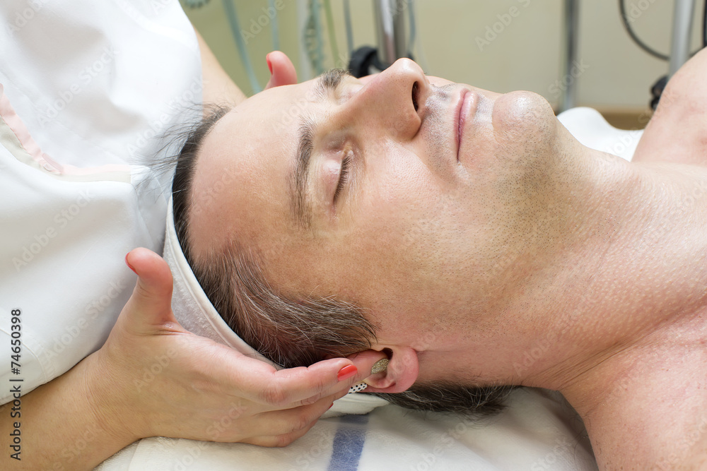 man in a beauty salon facial and massage man in a beauty salon facial and massage