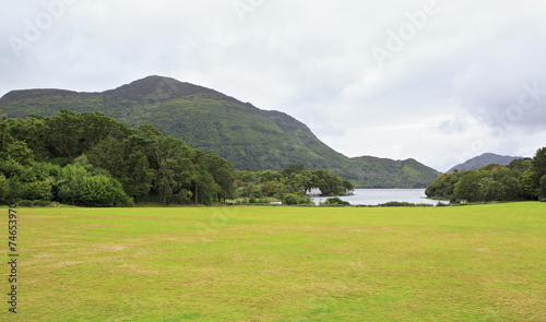 Green lawn in front of Muckross Lake.